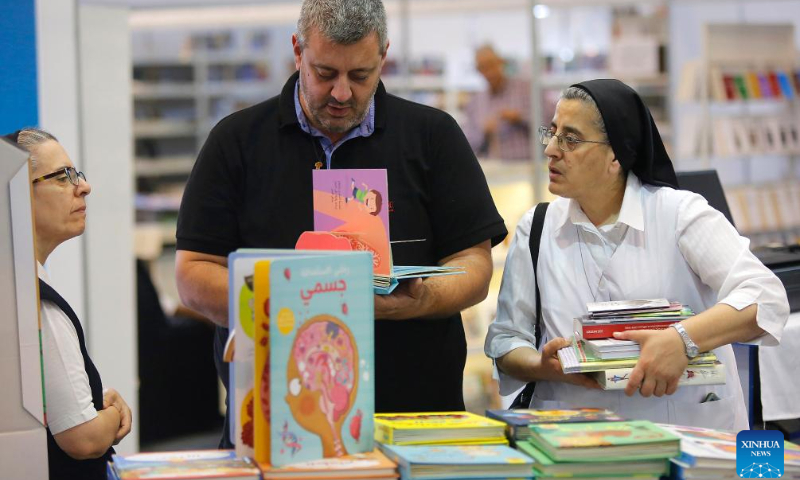People visit the Lebanon International Book Fair in Beirut, Lebanon, Oct.14, 2023. The 2023 Lebanon International Book Fair taking place from Oct. 13 to 22 was held at the Forum De Beyrouth in Beirut. (Xinhua/Bilal Jawich)