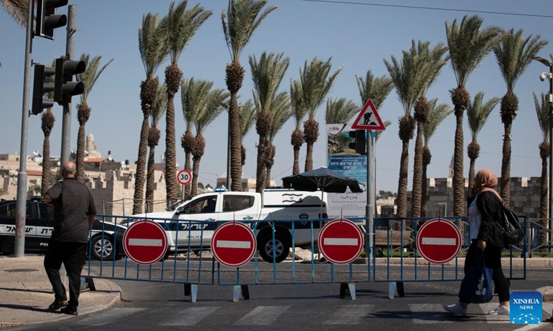 Roadblocks are seen set up on a road during Yom Kippur in Jerusalem, on Sept. 25, 2023. Yom Kippur, Jewish Day of Atonement, is a solemn day of reflection and fasting, on which most automobiles are not allowed on roads.(Photo: Xinhua)