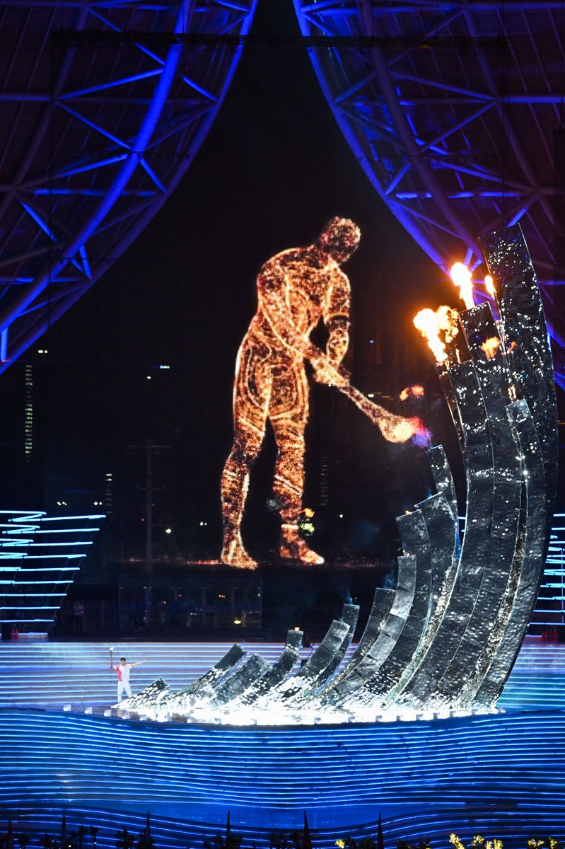 A digital torchbearer lights the cauldron during the opening ceremony of Hangzhou Asian Games on September 23, 2023. Photo: VCG