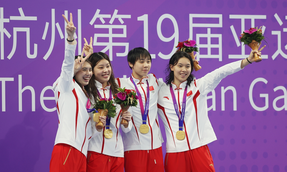 Chinese swimmers celebrate winning gold in the women's 4x100 meters freestyle relay at the Asian Games on September 24, 2023. Photo: Cui Meng/Global Times