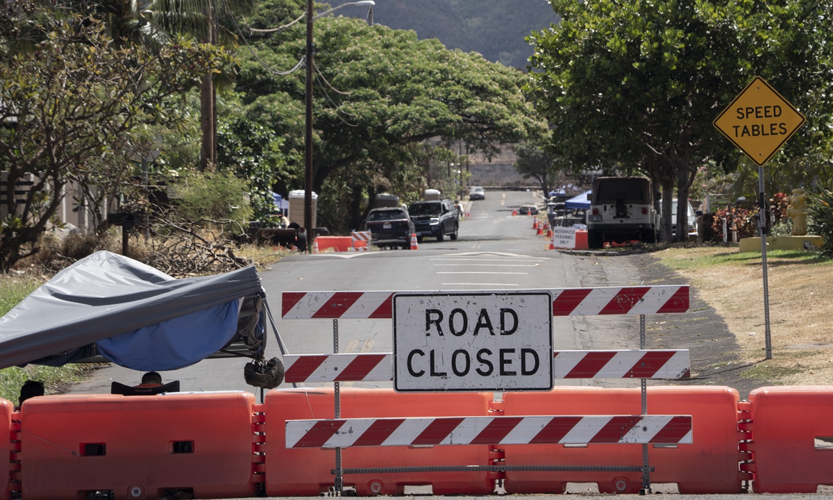 Title: Post-wildfire return

A checkpoint set up by the Hawaii National Guard is pictured on Kaniau Road, September 24, 2023, in Lahaina, Hawaii. Kaniau Road of Zone 1C will be the first zone to be cleared for residents to reenter following Maui's deadly wildfire, starting September 25. Photo: VCG
