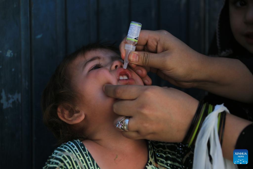 A child receives a dose of anti-polio vaccine in Kabul, Afghanistan, Sept. 25, 2023. Afghanistan's Ministry of Public Health on Monday launched a nationwide anti-polio campaign in the war-ravaged country. During the four-day campaign, 11 million children under five will receive doses of the anti-polio vaccine for immunization as part of the country's efforts to eradicate the crippling disease among children, it said in a press release.(Photo: Xinhua)