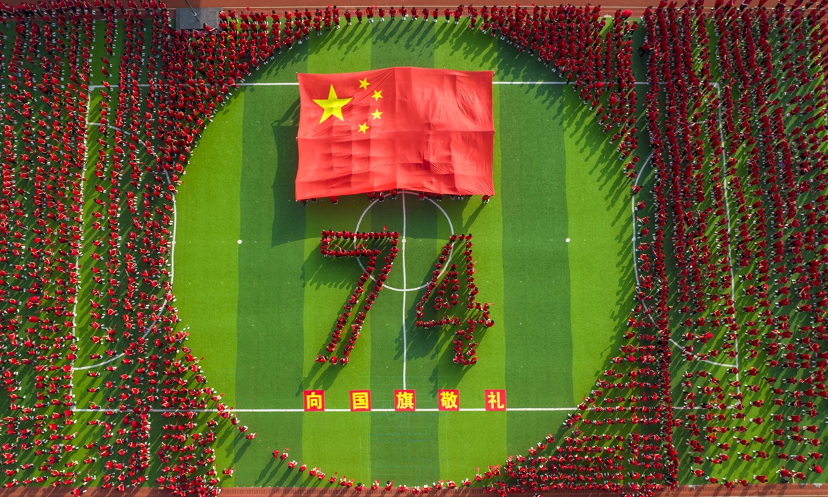A primary School in Xinyu, East China's Jiangxi Province, held a patriotic education activity themed Salute to the national flag, Praise the flourishing age of China to celebrate the upcoming 74th anniversary of the People's Republic of China that will fall on October 1. Photo: VCG