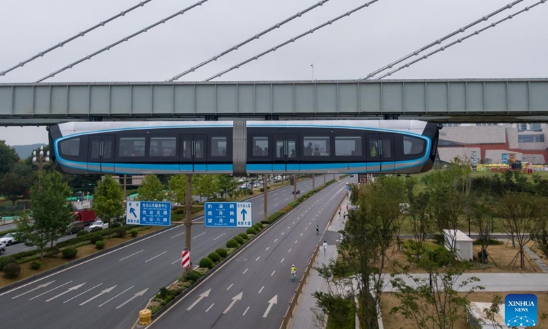 This aerial photo taken on Sept. 26, 2023 shows a new suspended monorail line in operation in Wuhan, central China's Hubei Province. China's first commercial suspended monorail line opened to the public on Tuesday in Wuhan, capital of central China's Hubei Province. The suspended monorail line operates for 12 hours every day, with a monorail departing every 10 minutes. The maximum operating speed of the monorail train is 60 km per hour. (Photo: Xinhua)