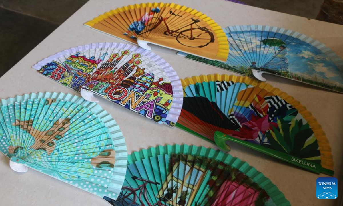 This photo taken on Sept. 12, 2023 shows wooden fans processed by UV flatbed printers at a fan company in Ganzhu Township in Guangchang County, east China's Jiangxi Province. (Xinhua/Zhu Yunuo)