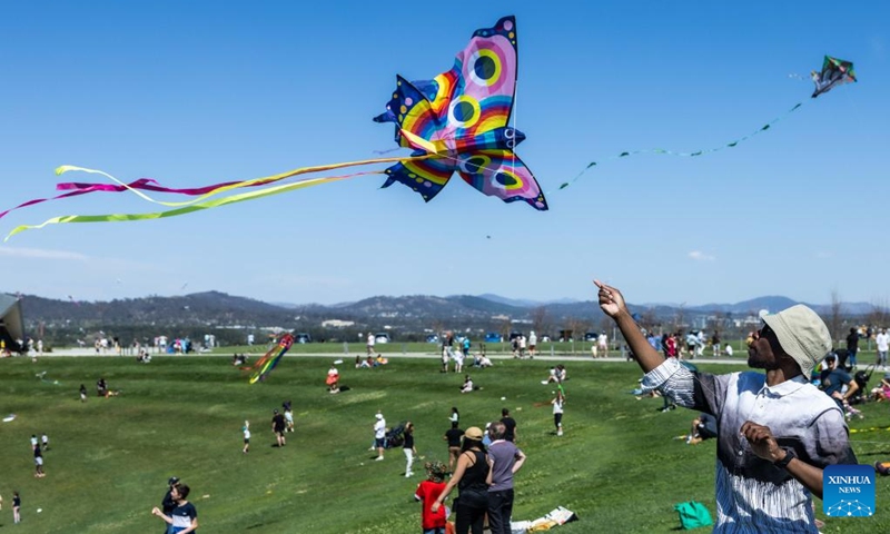 A man flies a kite during the Kite Fest at the National Arboretum Canberra in Canberra, Australia, Oct. 1, 2023. The National Arboretum Canberra held its yearly Kite Fest in Canberra on Sunday. Visitors can enjoy a variety of events such as pop-up food options, kite-making workshops, kite demonstrations, live entertainment and picnic. (Photo by Chu Chen/Xinhua)