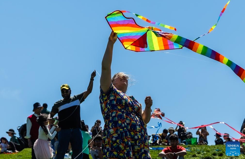 A woman flies a kite during the Kite Fest at the National Arboretum Canberra in Canberra, Australia, Oct. 1, 2023. The National Arboretum Canberra held its yearly Kite Fest in Canberra on Sunday. Visitors can enjoy a variety of events such as pop-up food options, kite-making workshops, kite demonstrations, live entertainment and picnic. (Photo by Chu Chen/Xinhua)