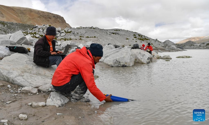 Members of a Chinese expedition team perform a real-time water quality check at a proglacial lake in the Mount Cho Oyu region on Oct. 1, 2023. An 18-member expedition team successfully reached on Sunday the summit of Mount Cho Oyu, also known as Mt. Qowowuyag, which soars to 8,201 meters above sea level, to carry out scientific research. It was the first time Chinese scientists scaled a peak exceeding 8,000 meters in altitude apart from Mt. Qomolangma, the world's highest summit. Photo: Xinhua