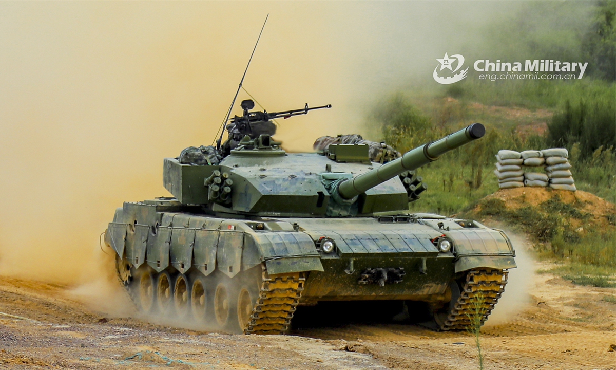 A Type-96 tank attached to a brigade under the PLA 71st Group Army marches on a mud road during a training exercise. The exercise was held in upper September with the purpose to assess the troops' ability to combat under emergence situation. (eng.chinamil.com.cn/Photo by Wan Zhiqi)