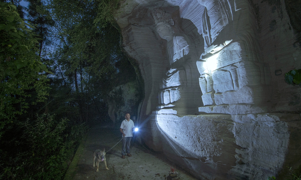 Zeng Xiangyu patrols the mountains with Black Tiger in August, 2019. Photo: Courtesy of Yuan Rongsun

