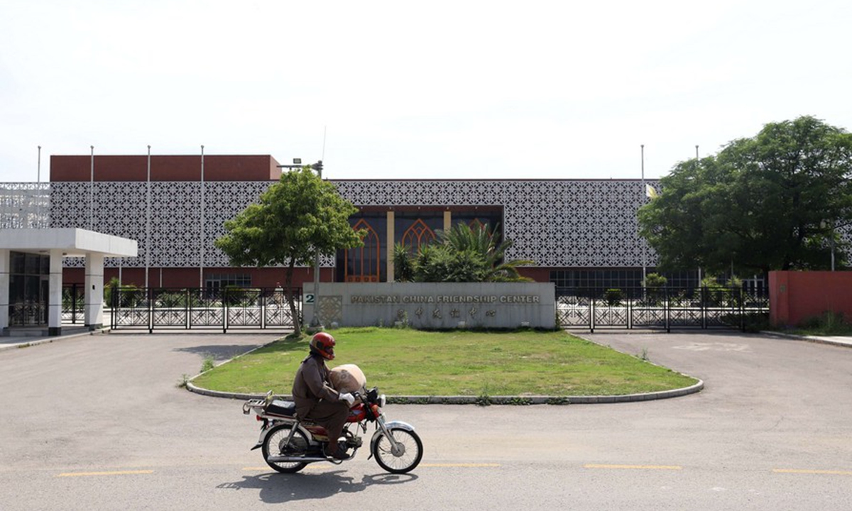 A motorcyclist drives past the building of Pakistan-China Friendship center in Islamabad, capital of Pakistan, on May 22, 2019. (Xinhua/Ahmad Kamal)



