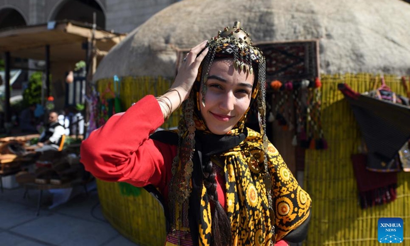 A girl in traditional costume is seen at an event in Tehran, Iran, Oct. 5, 2023. People from all parts of the country gathered here to exhibit and sell traditional products. (Xinhua/Shadati)