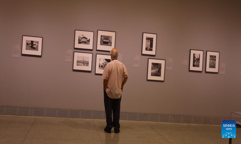 A visitor views a photograph at the preview of a photo exhibition titled Robert Frank and Todd Webb: Across America, 1955 at the Museum of Fine Arts, Houston, Texas, the United States, on Oct. 6. 2023. A total of 100 photographs chart the cross-country journeys of two photographers, who each captured singular views of America in the mid-20th century, during the exhibition here from Oct. 8, 2023 to Jan. 7, 2024. (Xinhua/Xu Jianmei)