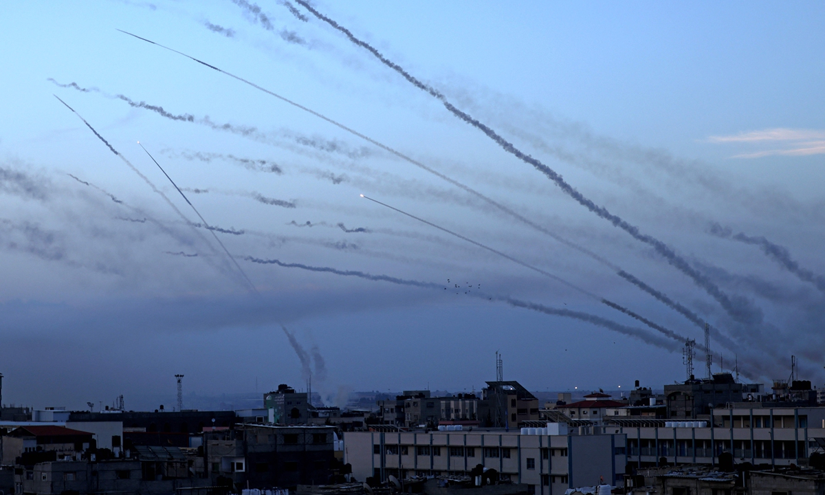 A barrage of rockets fired from Gaza into Israel are seen in the sky of the southern Gaza Strip city of Rafah, on Saturday Octpber 7, 2023. So far, 908 wounded people have been taken to Israeli hospitals, the Israeli health ministry said. Separately, at least 40 people have died in Israel, officials said earlier, according to media. In Gaza, nearly 200 are dead and more than 1,600 are injured, Palestinian health ministry said. Photo: Xinhua