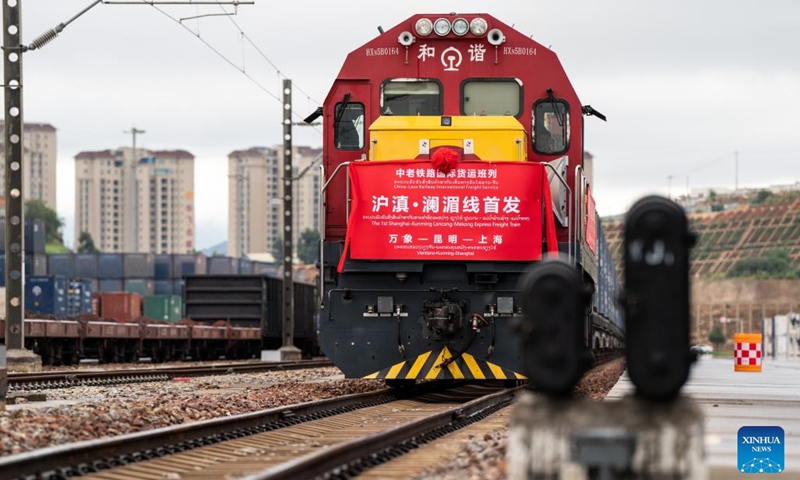 This photo taken on Oct. 8, 2023 shows a view of the launch ceremony of the 1st freight train of Shanghai-Kunming Lancang-Mekong Express at Wangjiaying West Station in Kunming, southwest China's Yunnan Province. A freight train loaded with goods from Southeast Asia and specialty products of Yunnan left Kunming on Sunday, and was expected to reach its destination Shanghai in 82 hours.(Photo: Xinhua)