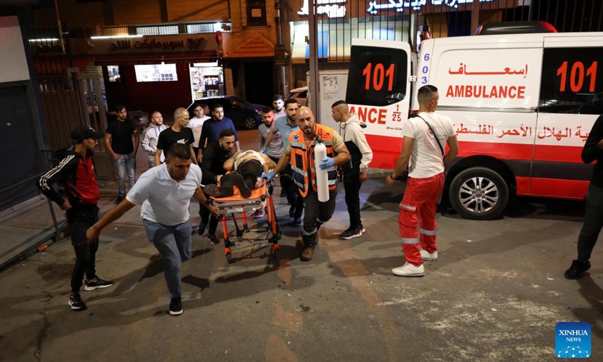 Palestinian medics transfer an injured man to a hospital in the West Bank city of Nablus, on Oct. 5, 2023. At least two Palestinians were killed and six Israeli soldiers wounded during the new round of clashes in the West Bank, Palestinian and Israeli sources said. Photo:Xinhua