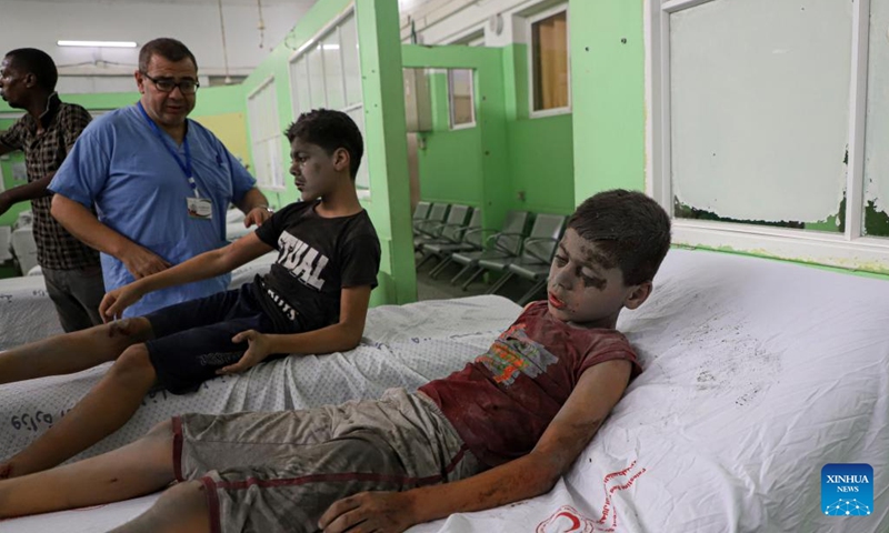 Children injured in an Israeli airstrike are treated at a hospital in Gaza City, on Oct. 9, 2023. The death toll and injuries from Israeli attacks on the Gaza Strip have risen to 687 and 3,726, respectively, according to the latest update by the Palestinian Health Ministry on Monday. The death toll from Hamas' weekend surprise attack on southern Israel rose to more than 900, Israel's state-owned Kan TV reported on Monday.(Photo: Xinhua)