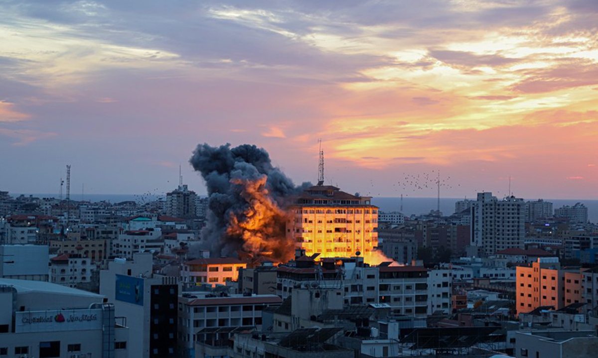 Smoke rises during an Israeli airstrike targeting a residential tower in Gaza City, on Oct. 7, 2023. (Photo by Rizek Abdeljawad/Xinhua)