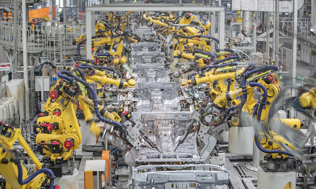 Smart welding robots perform welding operations in an automotive production welding workshop in Southwest China's Chongqing Municipality on March 1, 2023. Photo: Xinhua