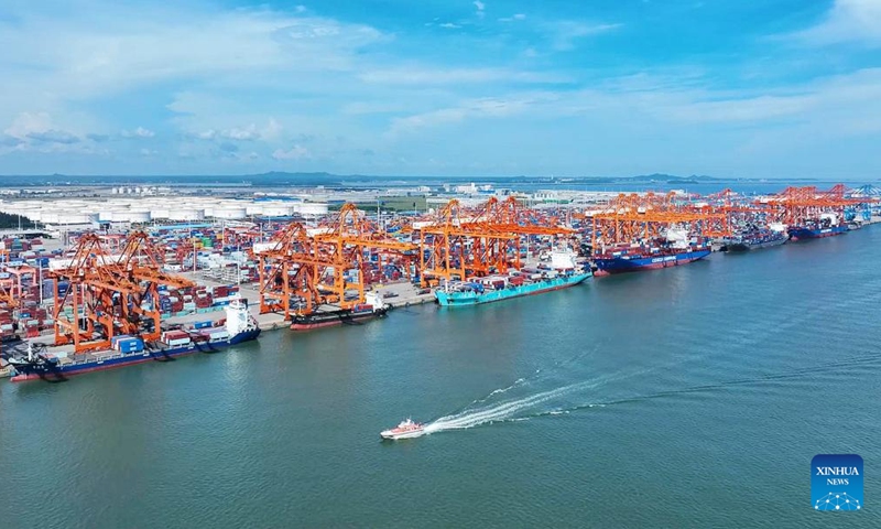 This aerial photo taken on Oct. 9, 2023 shows container vessels waiting in line to unload at the Qinzhou Port in Qinzhou, south China's Guangxi Zhuang Autonomous Region. (Photo: Xinhua）