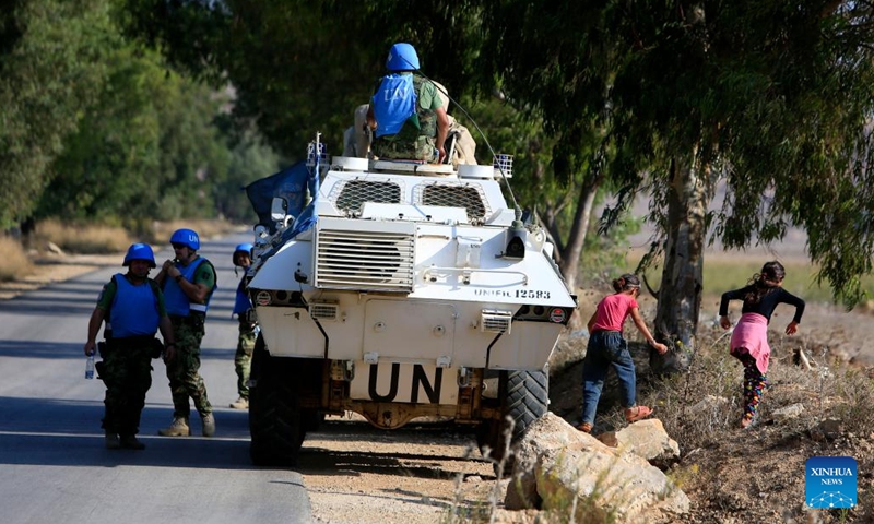 The United Nations Interim Force In Lebanon (UNIFIL) peacekeepers patrol on the Lebanese-Israeli border on Oct. 14, 2023. A fighter with Hezbollah, a Lebanese military group, was killed in the Israeli attacks that targeted the Shebaa Farms on Saturday afternoon, a statement by the Shiite group reported.(Photo:Xinhua)