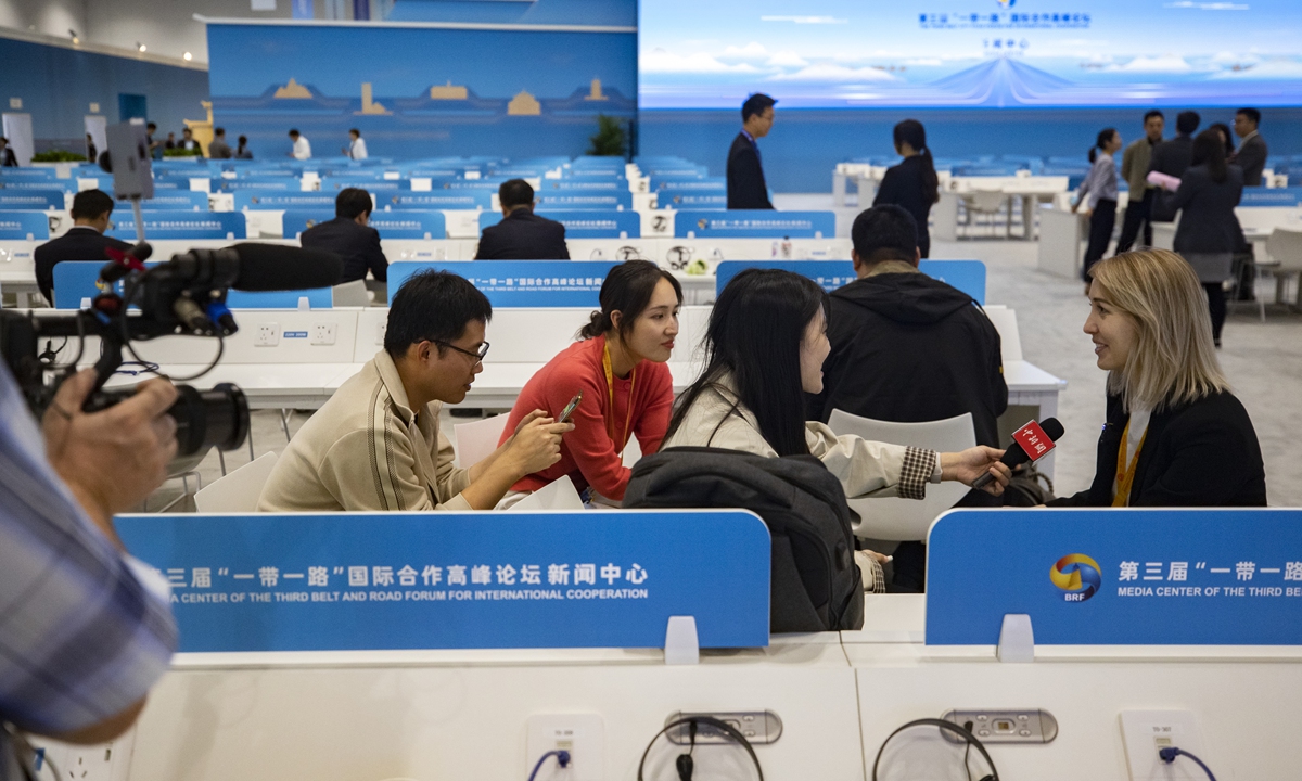 A foreigner is being interviewed by Chinese journalists in the media center for the third Belt and Road Forum for International Cooperation (BRF). The center started a trial run at the China National Convention Center on October 15, 2023.Photo:VCG