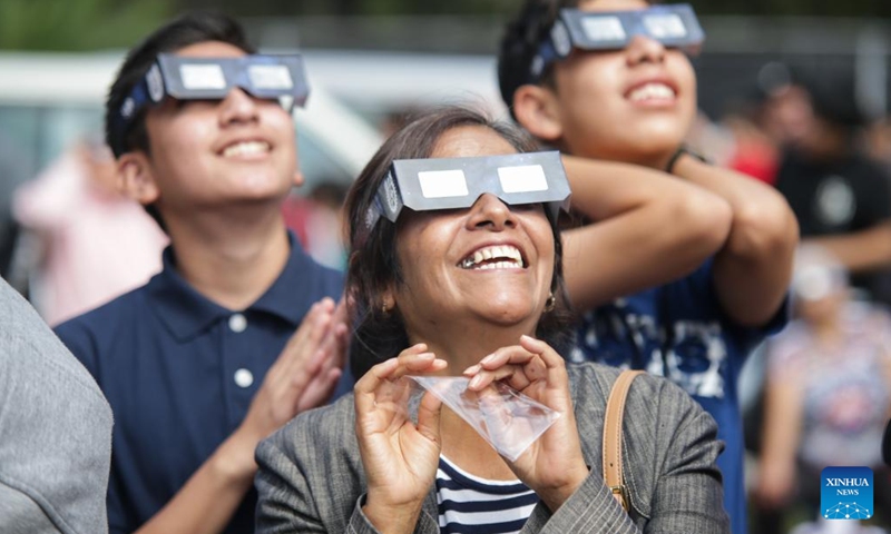 People observe a solar eclipse in Mexico City, Mexico, Oct. 14, 2023. (Photo:Xinhua)