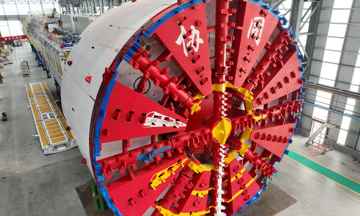A super-size tunnel boring machine (TBM) rolls off the assembly in Nantong, East China's Jiangsu Province on October 15, 2023. The machine has a working diameter of 13.8 meters and it will be used to build tunnels for a high-speed railway linking Beijing and Tianjin. Photo: VCG