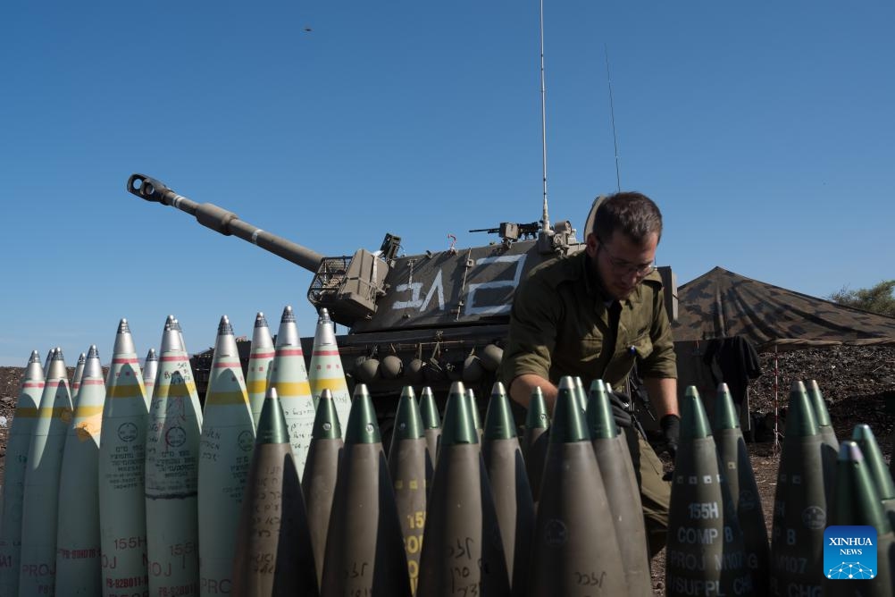 An Israeli soldier is seen at a position of a self-propelled howitzer deployed in northern Israel bordering Lebanon, on Oct. 18, 2023. Lebanon's Hezbollah said on Wednesday it has launched several attacks on Israeli targets with guided missiles. In a statement, the Shiite militant group said it targeted three Israeli sites with missiles, including a center for Israeli soldiers and a surveillance and reconnaissance system south of Al-Manara in northern Israel, causing several casualties.(Photo: Xinhua)