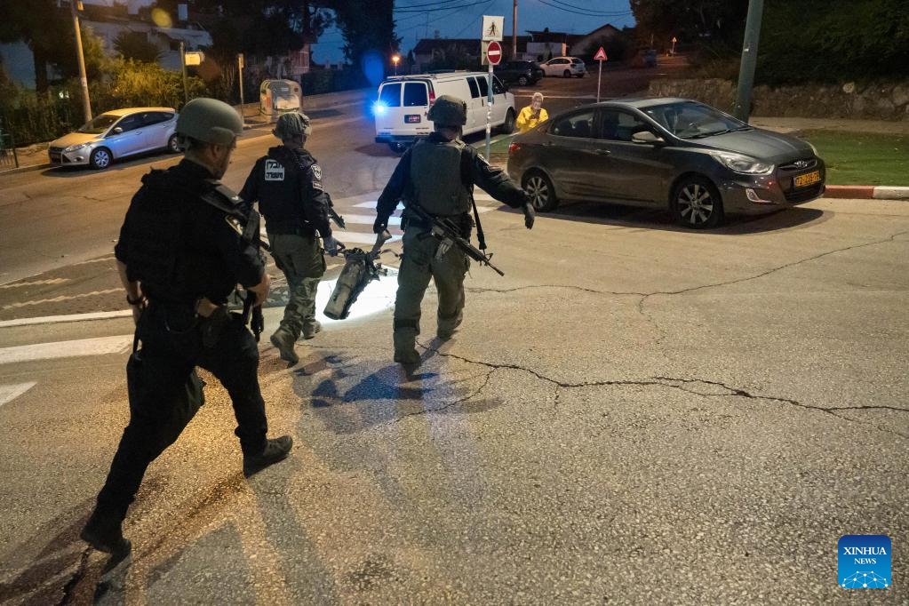 Israeli police handle the remains of a rocket fired from Lebanon, in Kiryat Shmona, northern Israel bordering Lebanon, on Oct. 18, 2023. Lebanon's Hezbollah said on Wednesday it has launched several attacks on Israeli targets with guided missiles. In a statement, the Shiite militant group said it targeted three Israeli sites with missiles, including a center for Israeli soldiers and a surveillance and reconnaissance system south of Al-Manara in northern Israel, causing several casualties.(Photo: Xinhua)