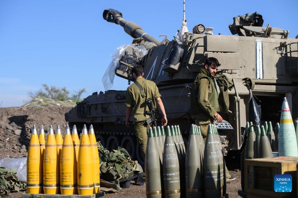 Israeli soldiers are seen at a position of a self-propelled howitzer deployed in northern Israel bordering Lebanon, on Oct. 18, 2023. Lebanon's Hezbollah said on Wednesday it has launched several attacks on Israeli targets with guided missiles. In a statement, the Shiite militant group said it targeted three Israeli sites with missiles, including a center for Israeli soldiers and a surveillance and reconnaissance system south of Al-Manara in northern Israel, causing several casualties. (Photo: Xinhua)