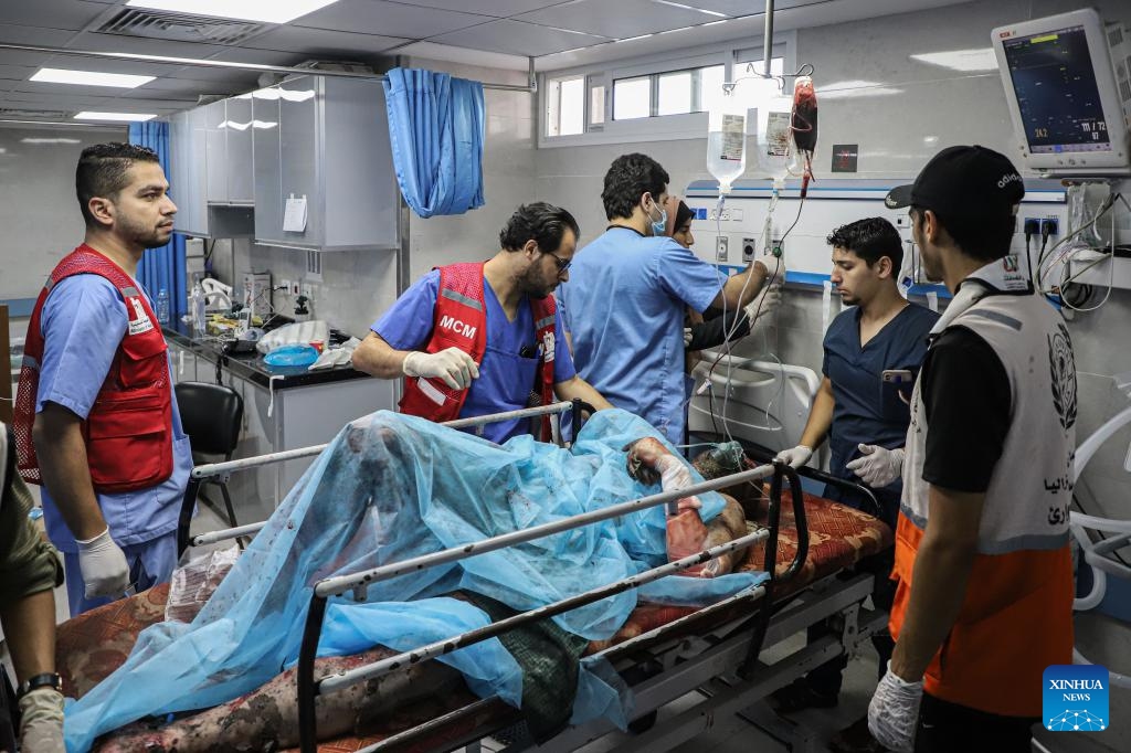 An injured man receives treatment at a hospital after Israeli airstrikes in Gaza City, Oct. 17, 2023. Since the bloody conflict between Hamas and Israel began on Oct. 7, a total of 2,808 Palestinians have been killed and 10,850 others wounded, according to figures released by the Hamas-run health ministry.(Photo: Xinhua)