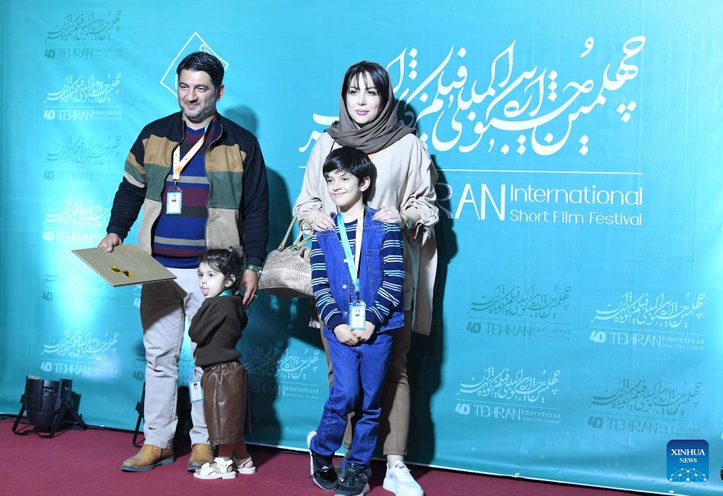 People pose for a photo at the 40th Tehran International Short Film Festival in Tehran, Iran, on Oct. 19, 2023. The 40th Tehran International Short Film Festival opened in Iran's capital Tehran on Thursday, the official news agency IRNA reported.(Photo: Xinhua)