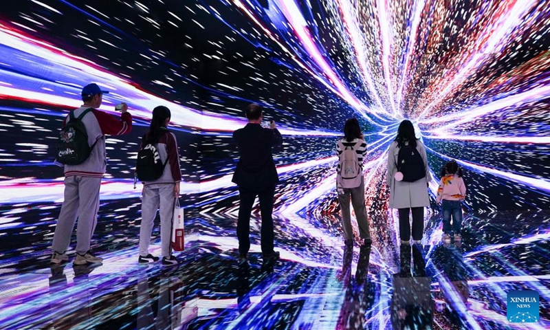 Visitors try an immersive environment of astronautic metaverse, a popular science program presented by Xinhua News Agency, during the 11th China (Wuhu) Popularized Science Products Exposition in Wuhu, east China's Anhui Province, Oct. 21, 2023. The expo kicked off here on Saturday. (Photo: Xinhua)
