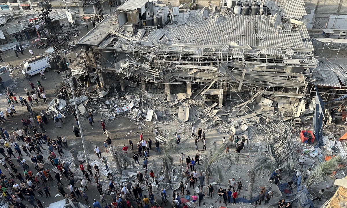 NUSEIRAT, GAZA - OCTOBER 22: A view of destruction after Israeli attack in Nuseirat camp, Gaza Strip on October 22, 2023. Photos show the extent of the damage in the area as the number of buildings and stores were heavily affected by the bombing. Photo:AFP