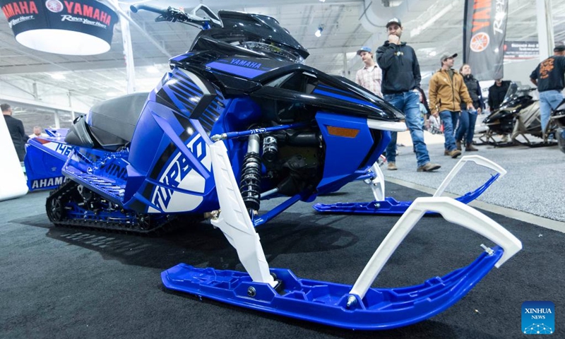 People look at a Yamaha snowmobile during the 2023 Toronto International Snowmobile, ATV & Powersports Show in Mississauga, the Greater Toronto Area, Canada, on Oct. 21, 2023. Showcasing new snowmobile and ATV line-ups from major manufacturers around the world, the annual show is held here from Oct. 20 to 22. (Photo: Xinhua)