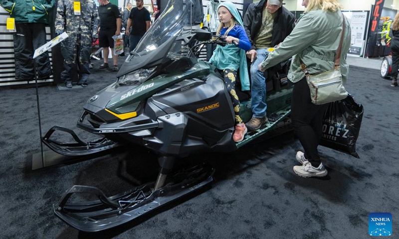 People try a Ski-Doo snowmobile during the 2023 Toronto International Snowmobile, ATV & Powersports Show in Mississauga, the Greater Toronto Area, Canada, on Oct. 21, 2023. Showcasing new snowmobile and ATV line-ups from major manufacturers around the world, the annual show is held here from Oct. 20 to 22. (Photo: Xinhua)