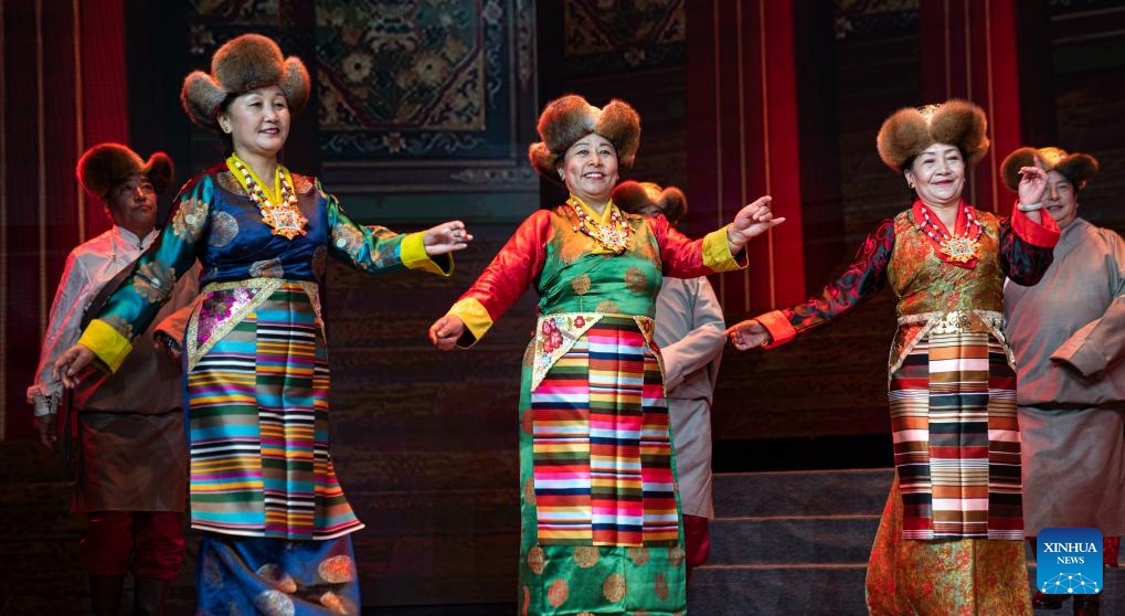 Senior artists perform during an art show celebrating the Chongyang Festival in Lhasa, southwest China's Tibet Autonomous Region, Oct. 23, 2023. An art show, presented by senior artists from various elderly troupes in Tibet, was held in Lhasa on Monday to celebrate the Chongyang Festival or the Double Ninth Festival for the elders.(Photo: Xinhua)
