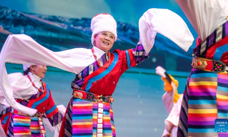 Senior artists perform during an art show celebrating the Chongyang Festival in Lhasa, southwest China's Tibet Autonomous Region, Oct. 23, 2023. An art show, presented by senior artists from various elderly troupes in Tibet, was held in Lhasa on Monday to celebrate the Chongyang Festival or the Double Ninth Festival for the elders.(Photo: Xinhua)