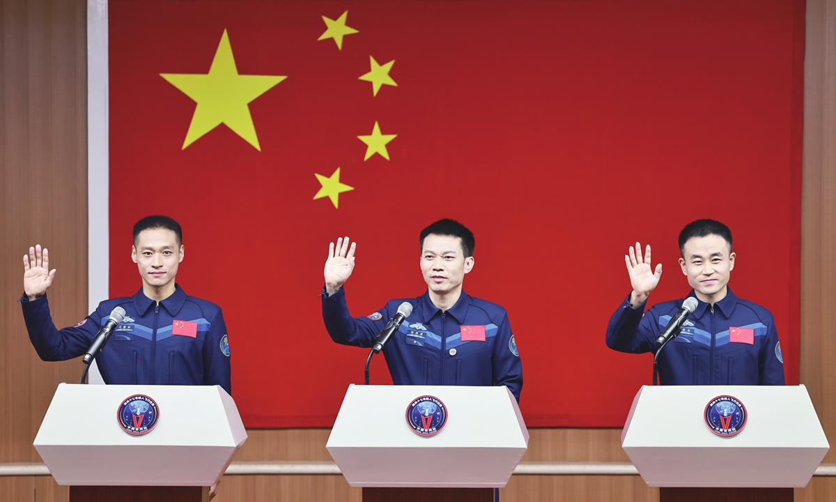 China's Shenzhou-17 mission crew, Jiang Xinlin (left), commander Tang Hongbo (center) and Tang Shengjie, appear at a press conference on October 24, 2023. The mission, which will see Jiang and Tang go to space for the first time, is gearing up for launch on October 25. Photo: Xinhua