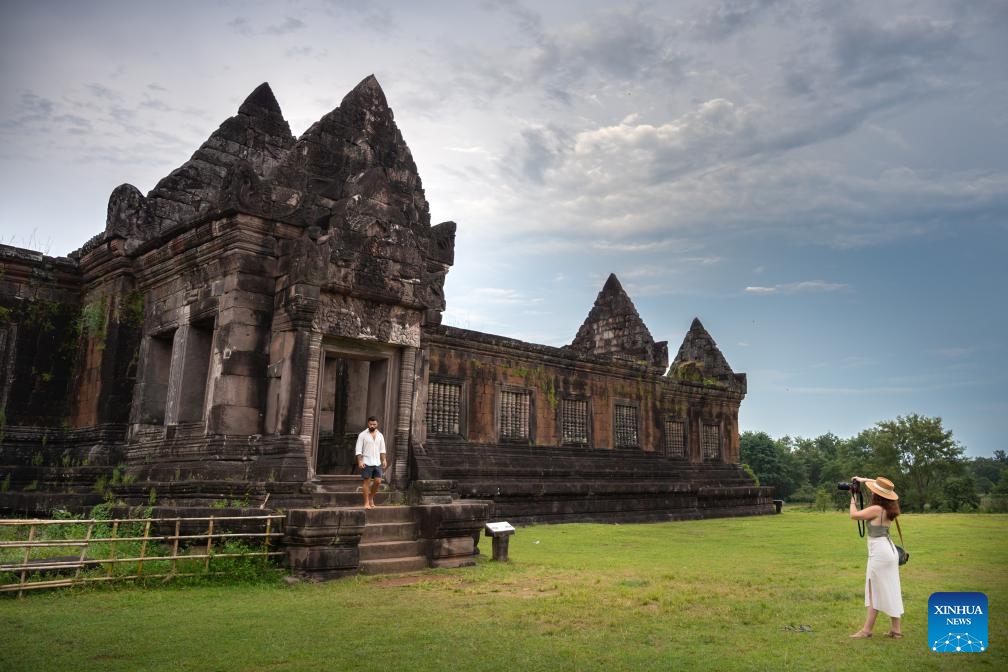 People visit the Vat Phou temple in Champasak, Laos, Oct. 20, 2023. The Vat Phou temple complex in Champassak province was declared a World Heritage Site in 2001.(Photo: Xinhua)
