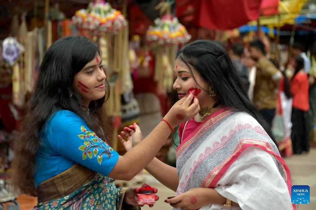 Hindu devotees participate in a celebration of Durga Puja festival in Dhaka, Bangladesh, Oct. 24, 2023.(Photo: Xinhua)