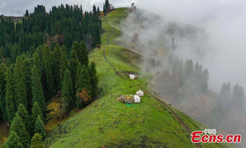 Spectacular landscape of fluffy clouds floating over Tianshan Mountains after a rainfall in northwest China's Xinjiang Uyghur Autonomous Region, Oct. 25, 2023.(Photo: ecns.cn)