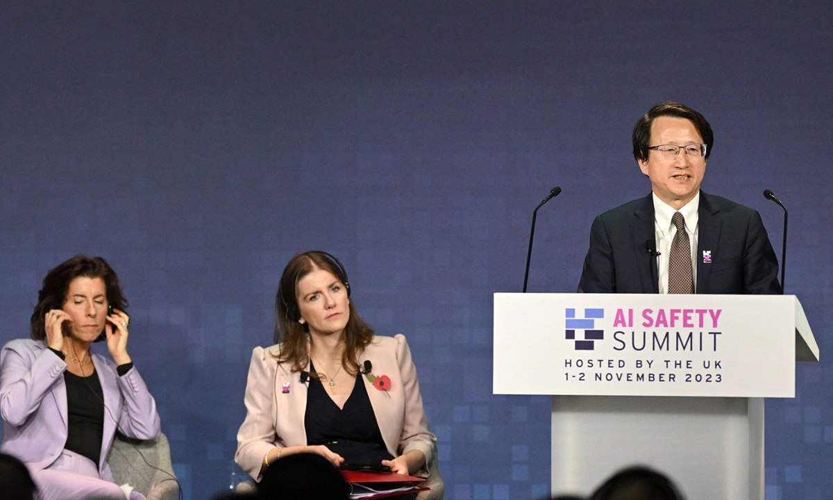 China's Vice Minister of Science and Technology Wu Zhaohui speaks during the UK Artificial Intelligence (AI) Safety Summit at Bletchley Park in central England on November 1, 2023 with US Commerce Secretary Gina Raimondo (left) and the UK's Science, Innovation and Technology Secretary Michelle Donelan listening. Photo: AFP