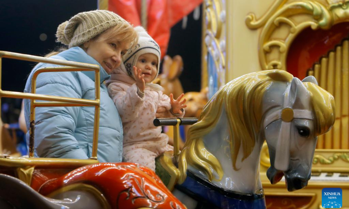 People enjoy the Bucharest Christmas Market at the Constitution Square in Bucharest, Romania, Nov 30, 2023. Photo:Xinhua