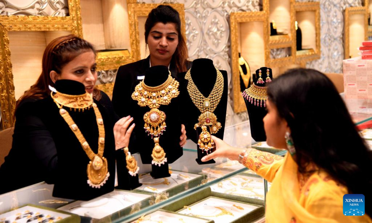 Hindu devotees purchase jewelry and utensils on occasion of Dhanteras