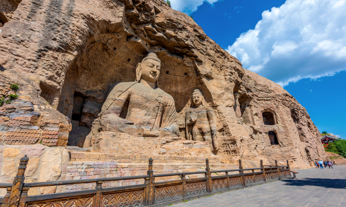 The giant stone-carved Buddhist statue (left) of Grotto No.20 and a cultural icon of the Yungang Grottoes Photo: VCG