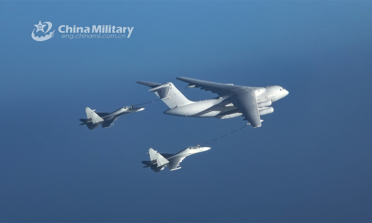 A tanker aircraft attached to an aviation brigade with the air force under the PLA Southern Theater Command refuels two fighter jets simultaneously in an aerial refueling mission during a long-endurance flight training exercise in mid October, 2023. Photo:China Military