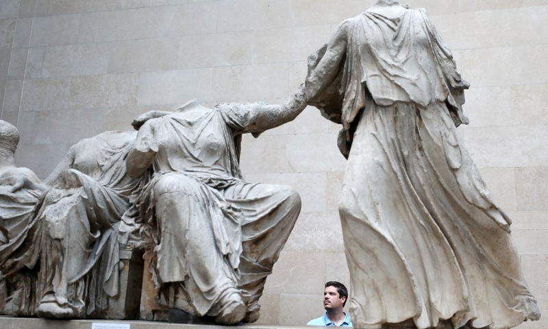 A man views the Parthenon Marbles, a collection of stone objects, inscriptions and sculptures, also known as the Elgin Marbles, in the British Museum in London, Britain, September 7, 2023. Photo: Xinhua