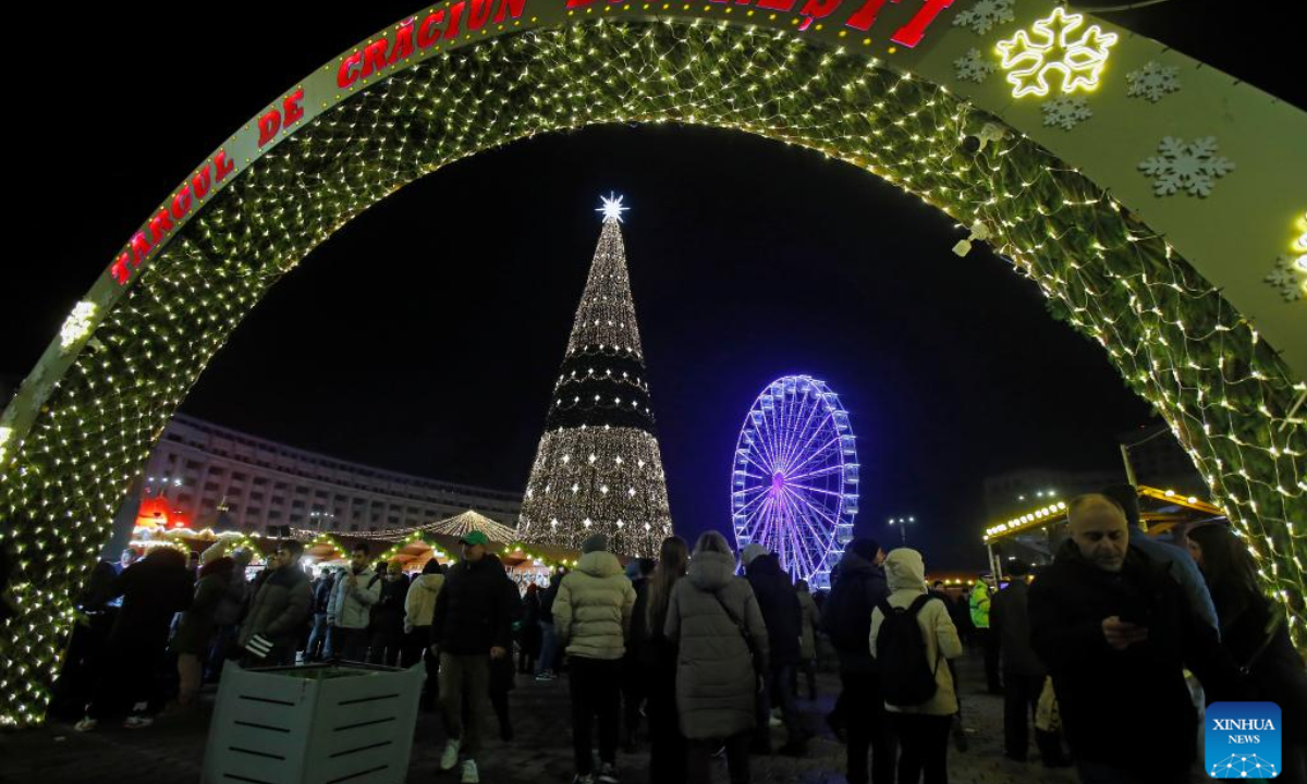 People visit the Bucharest Christmas Market at the Constitution Square in Bucharest, Romania, Nov 30, 2023. Photo:Xinhua